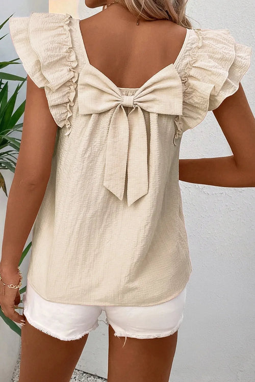 Beige blouse with bow tie at back neckline, ruffled cap sleeves, textured fabric