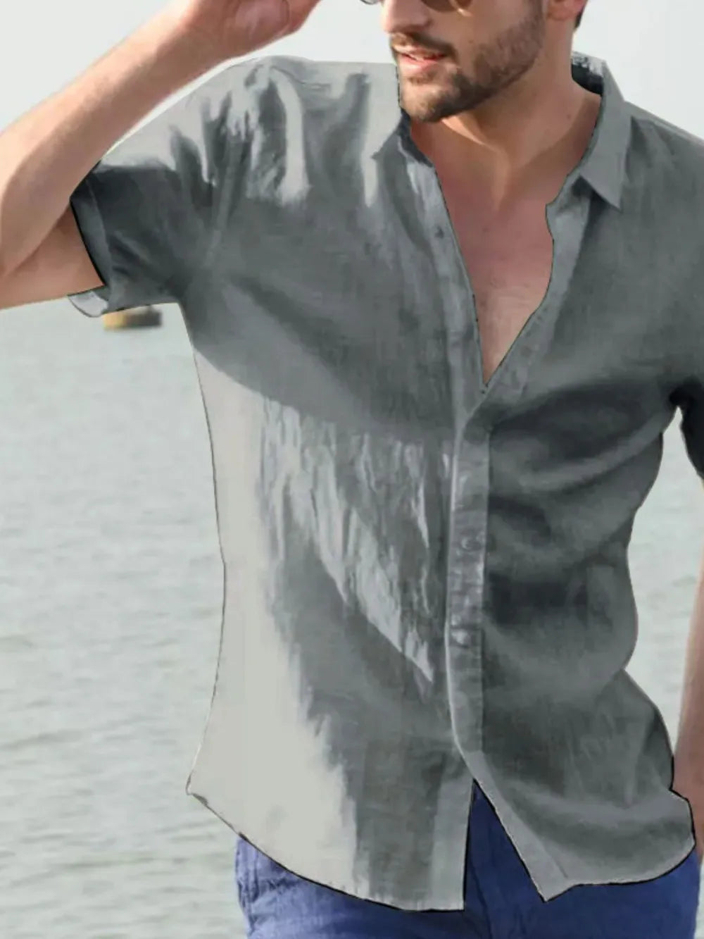 Men's short-sleeve button-down shirt, gray, front view with open collar and buttons