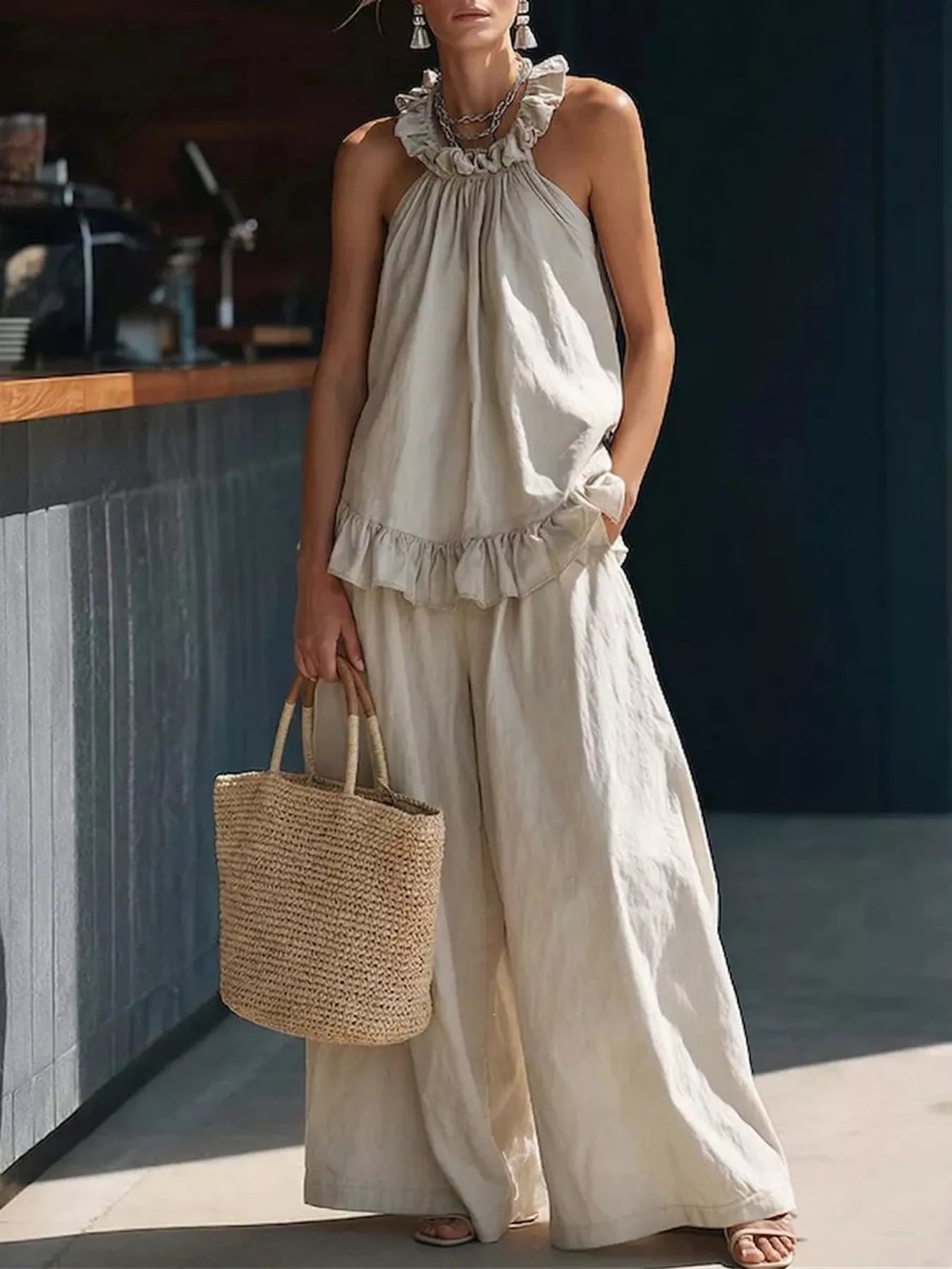Ivory ruffled halter neck top and wide-leg pants set, tiered ruffle hem and halter
