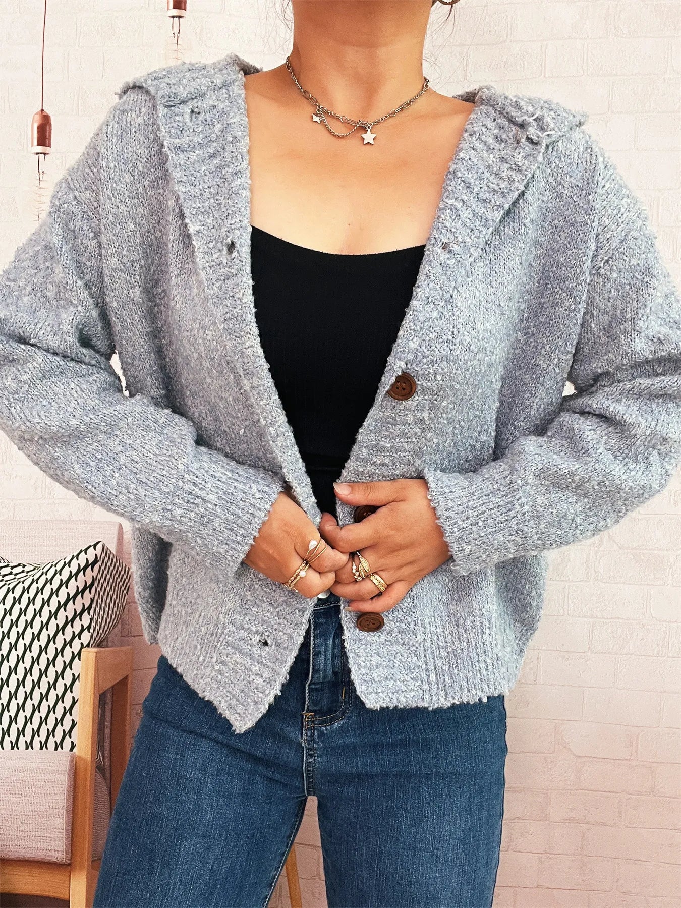 Cozy hooded cardigan, heather gray knit with button placket and hood.
