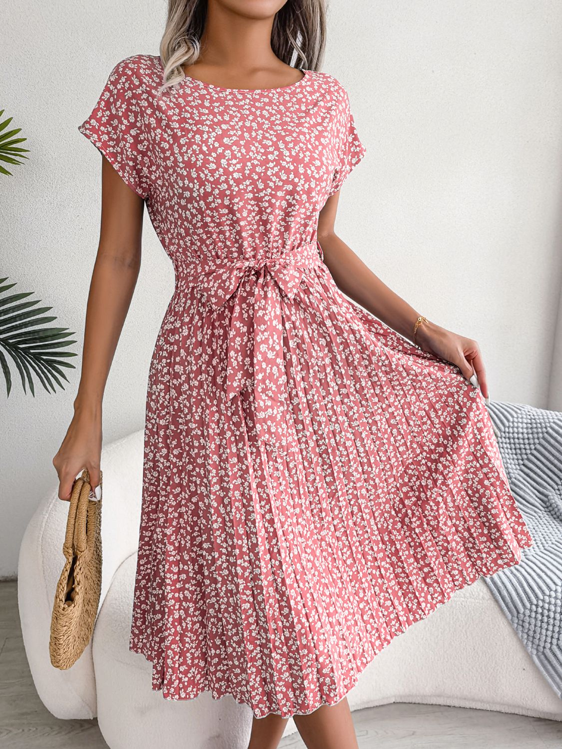 Ditsy floral pleated belted dress in blush pink with flutter cap sleeves