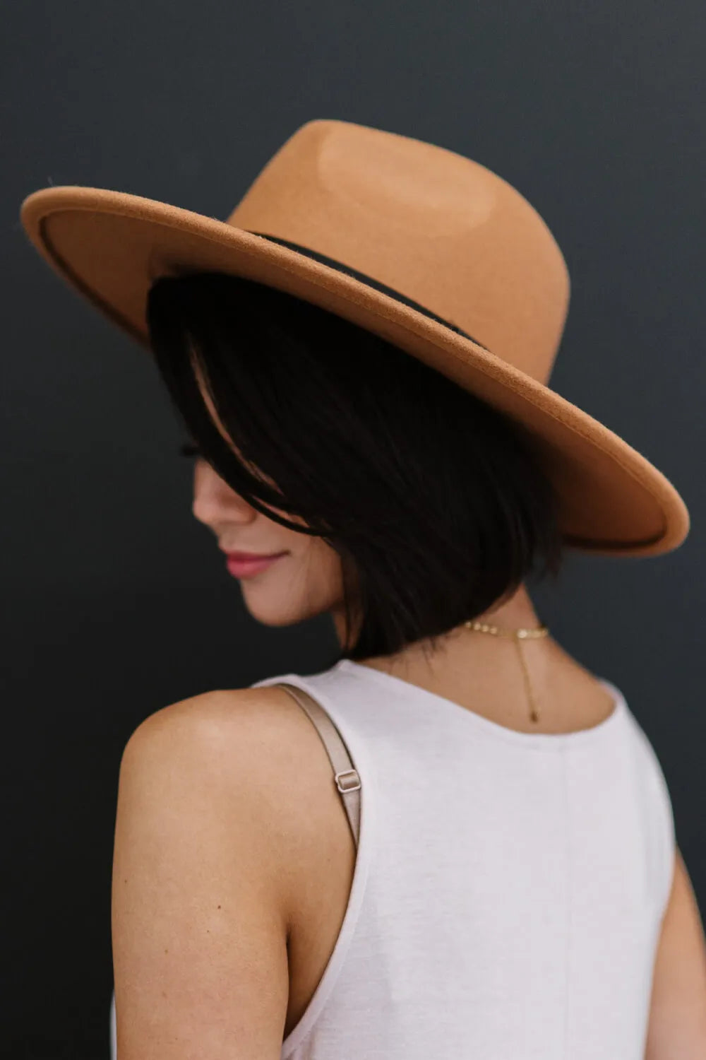 Khaki fedora hat with wide brim and black band