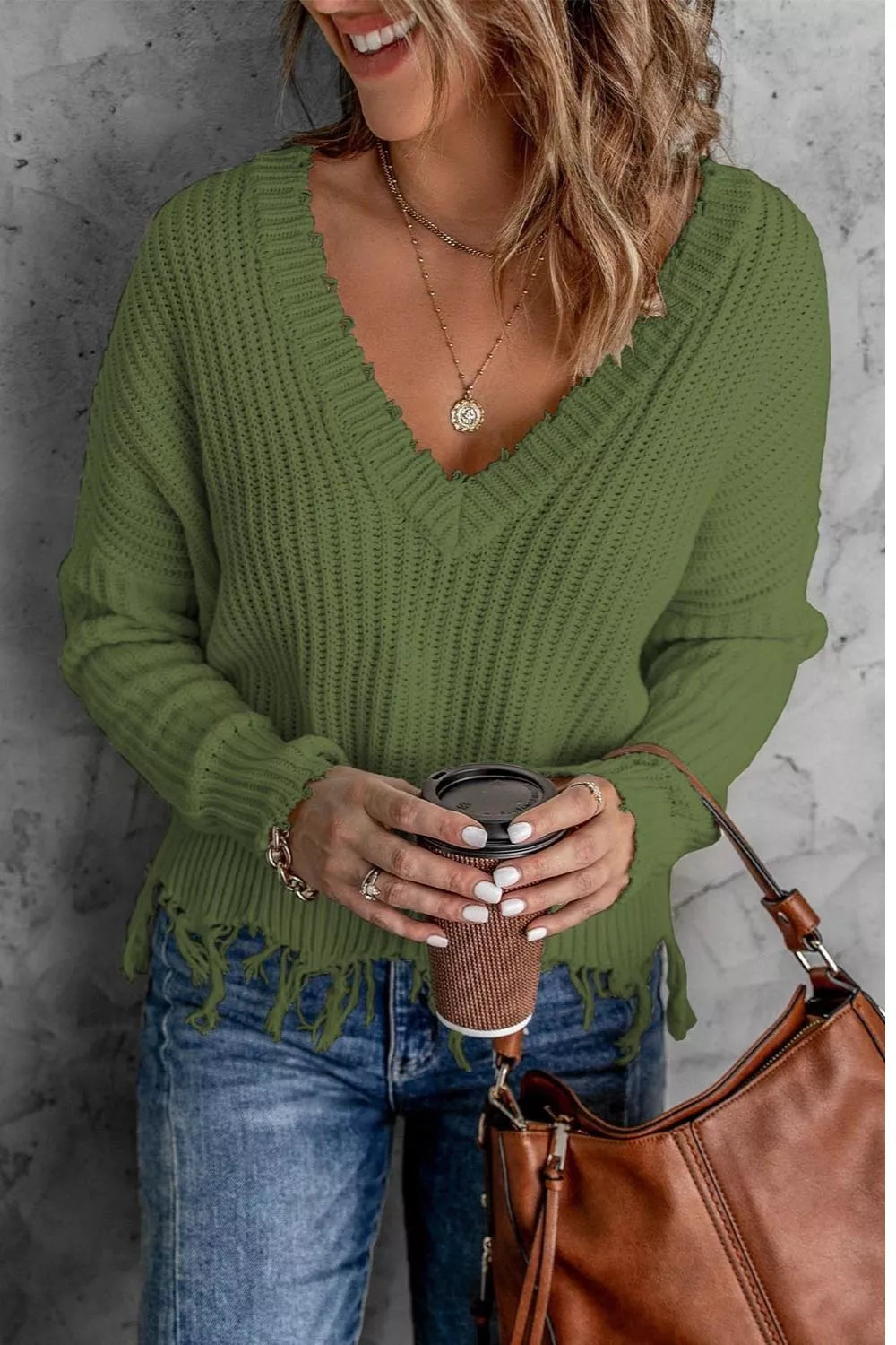 Army green V-neck knit sweater with raw hem fringe and ribbed trim