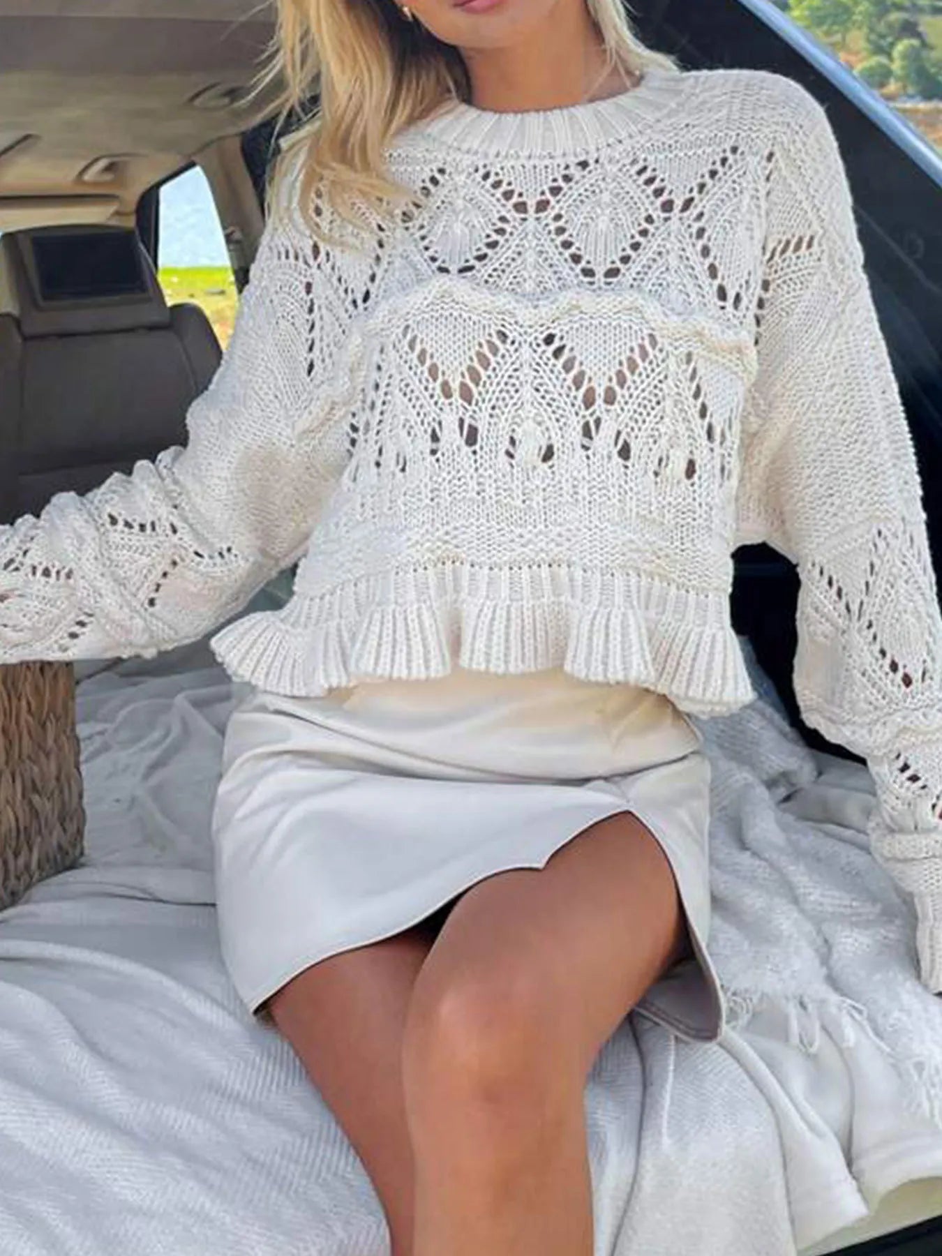 White crochet long sleeve sweater with ruffled hem and openwork diamond knit pattern