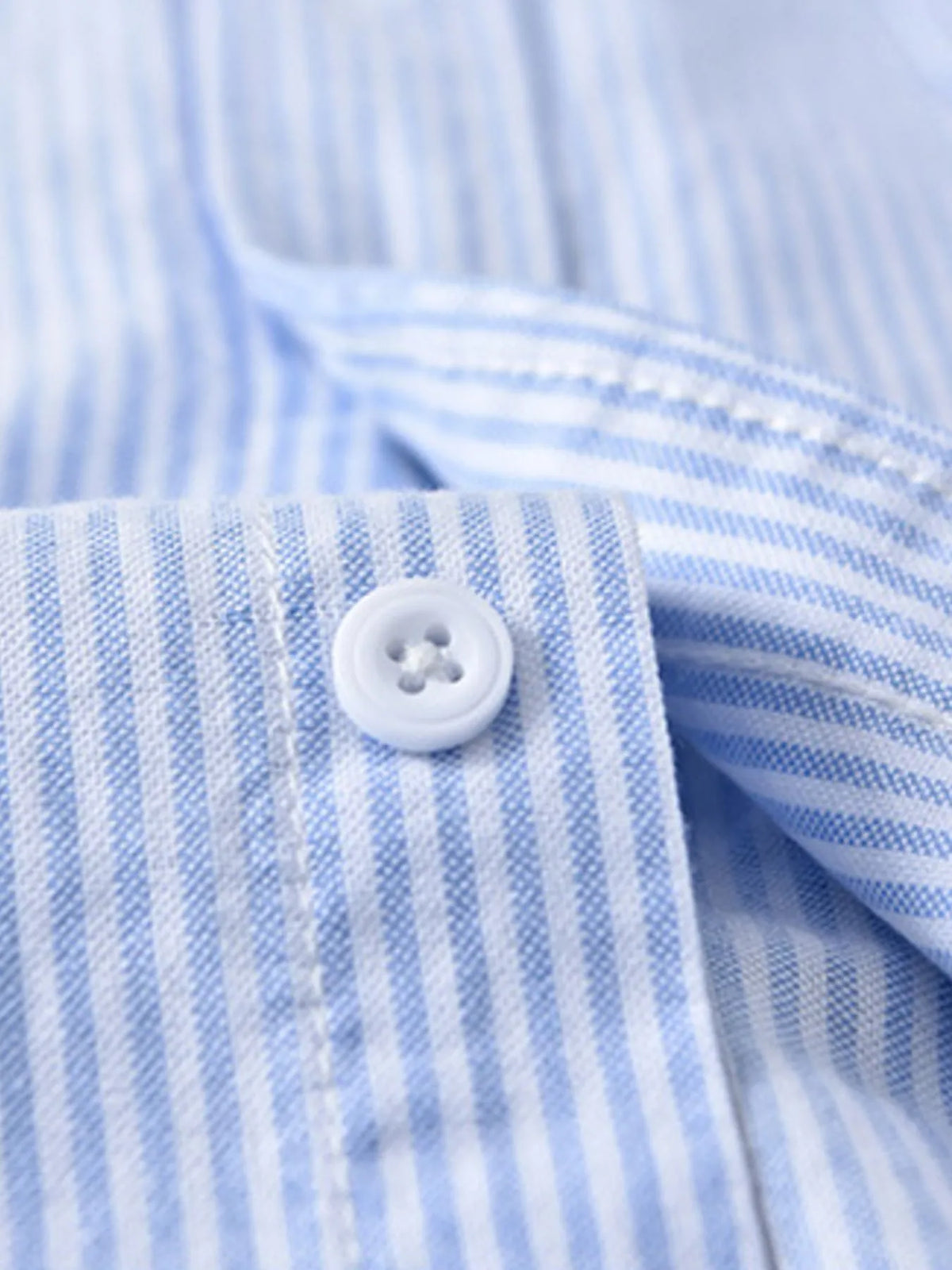 Mens blue striped cotton shirt cuff with white button