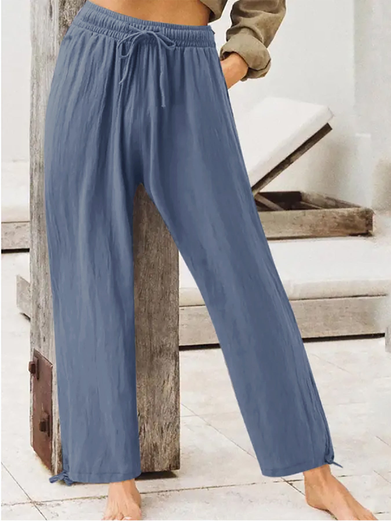 Women's wide-leg drawstring pants in dusty blue, elastic waist, relaxed fit.