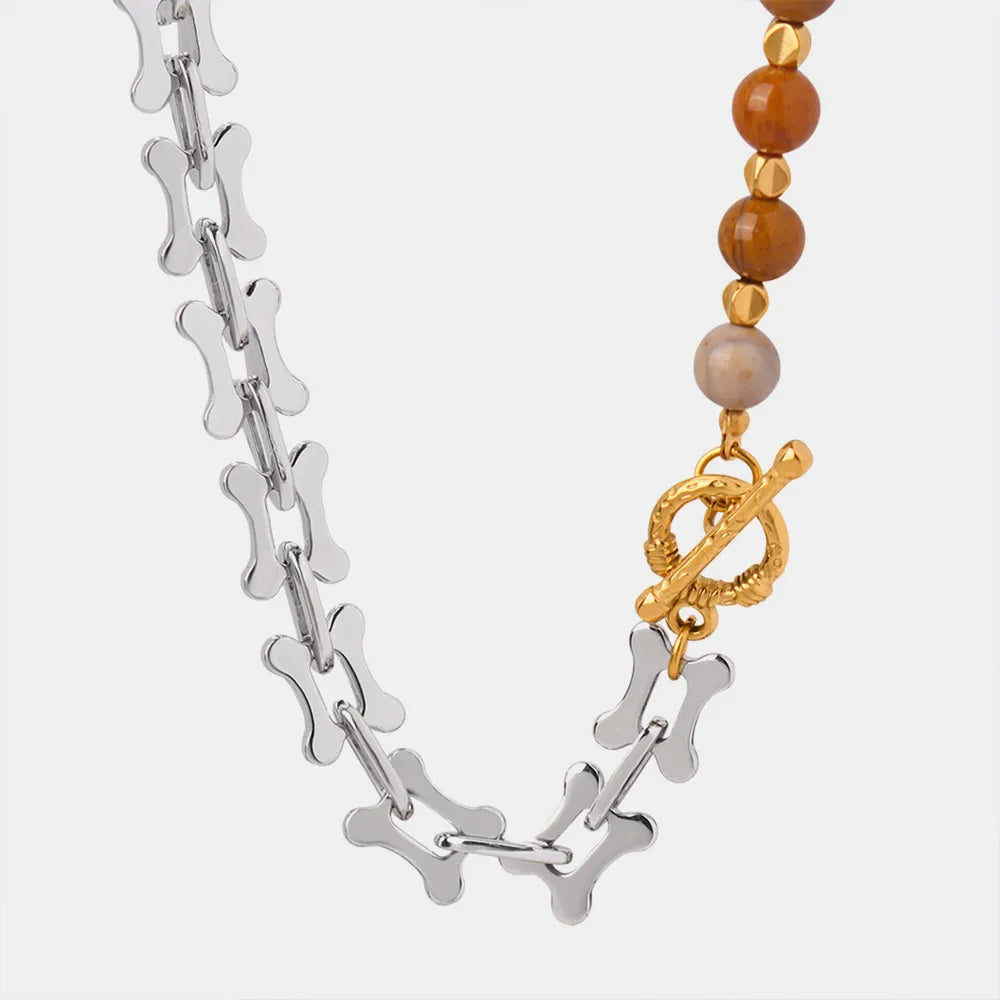 Silver-tone beaded necklace with orange and pink stones and a gold-tone pendant