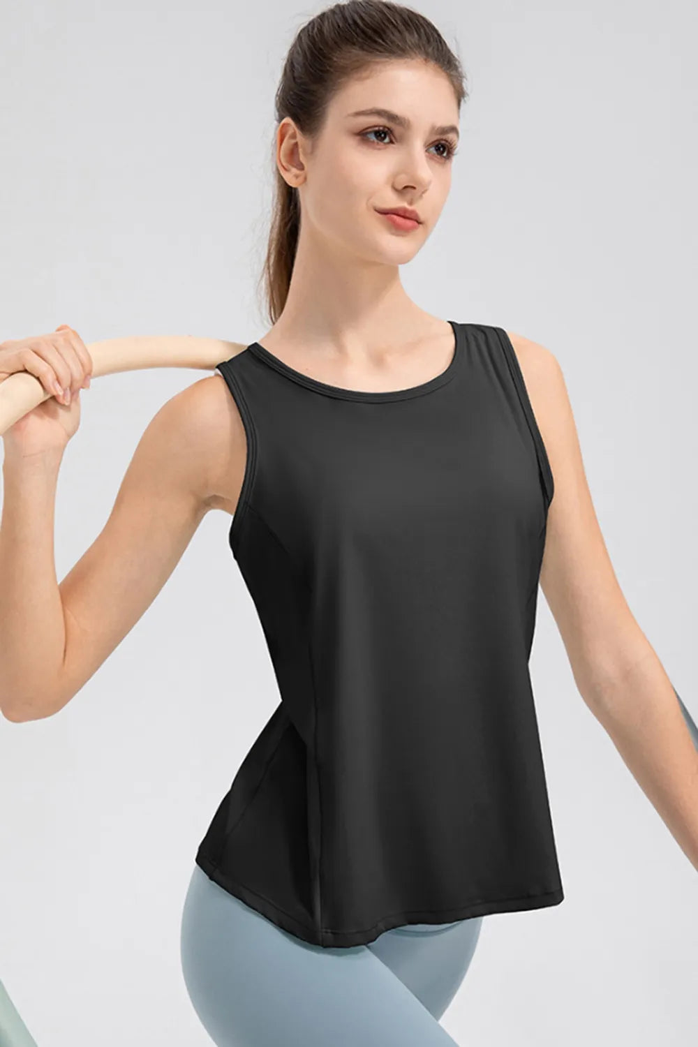 Women’s black active tank top with wide straps and round neckline, side detail