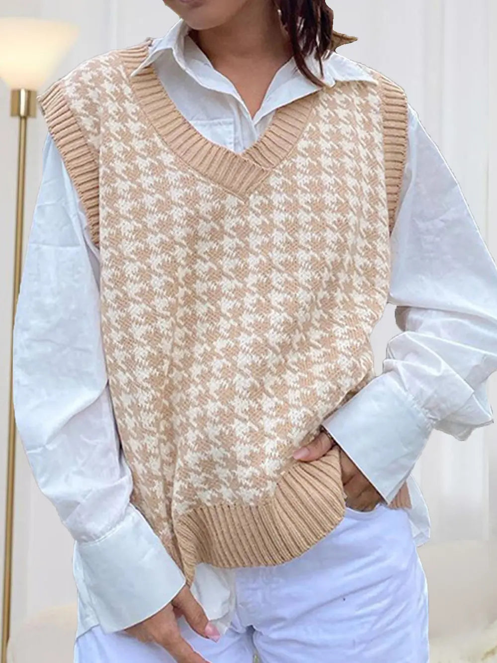 Beige houndstooth V-neck sleeveless sweater vest with ribbed hem and neckline