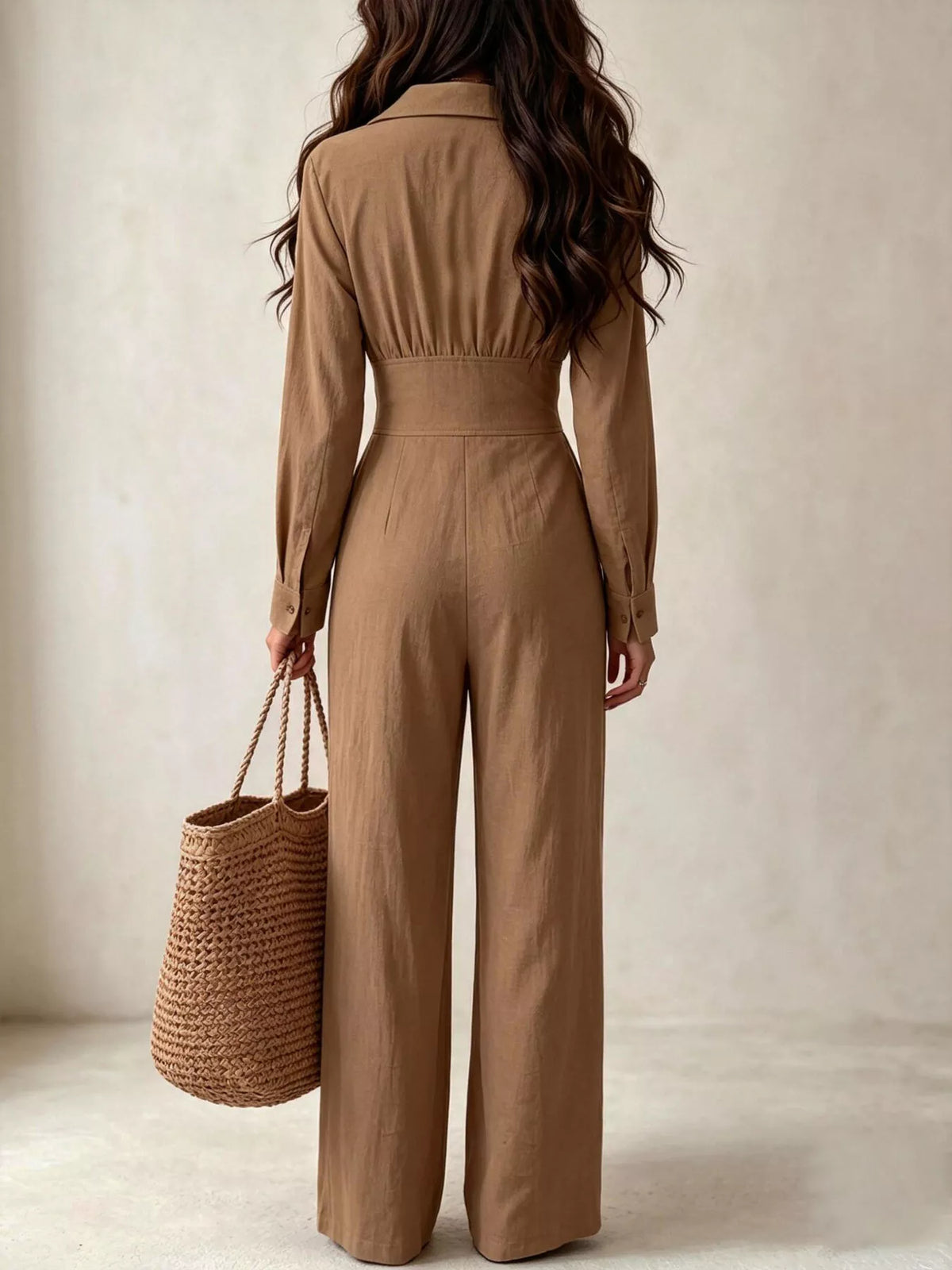 Brown wide-leg jumpsuit back view, long sleeves, cinched waist