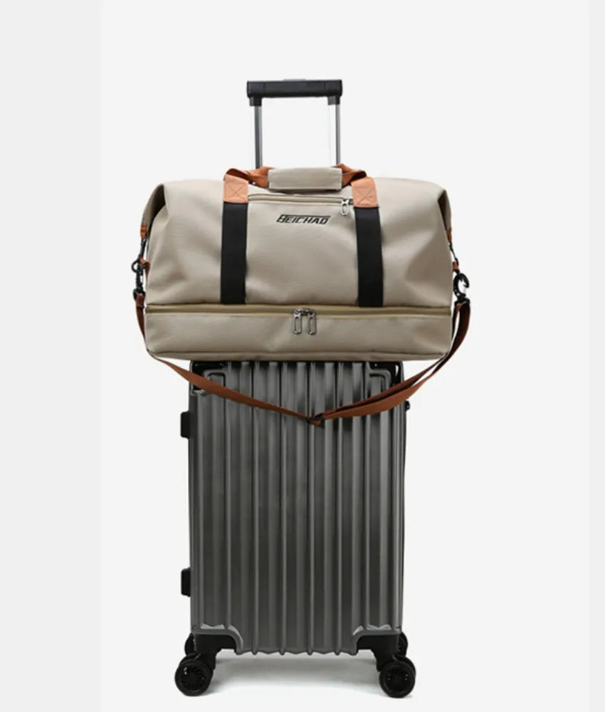 Khaki oversize travel duffle bag with black straps and front zipper