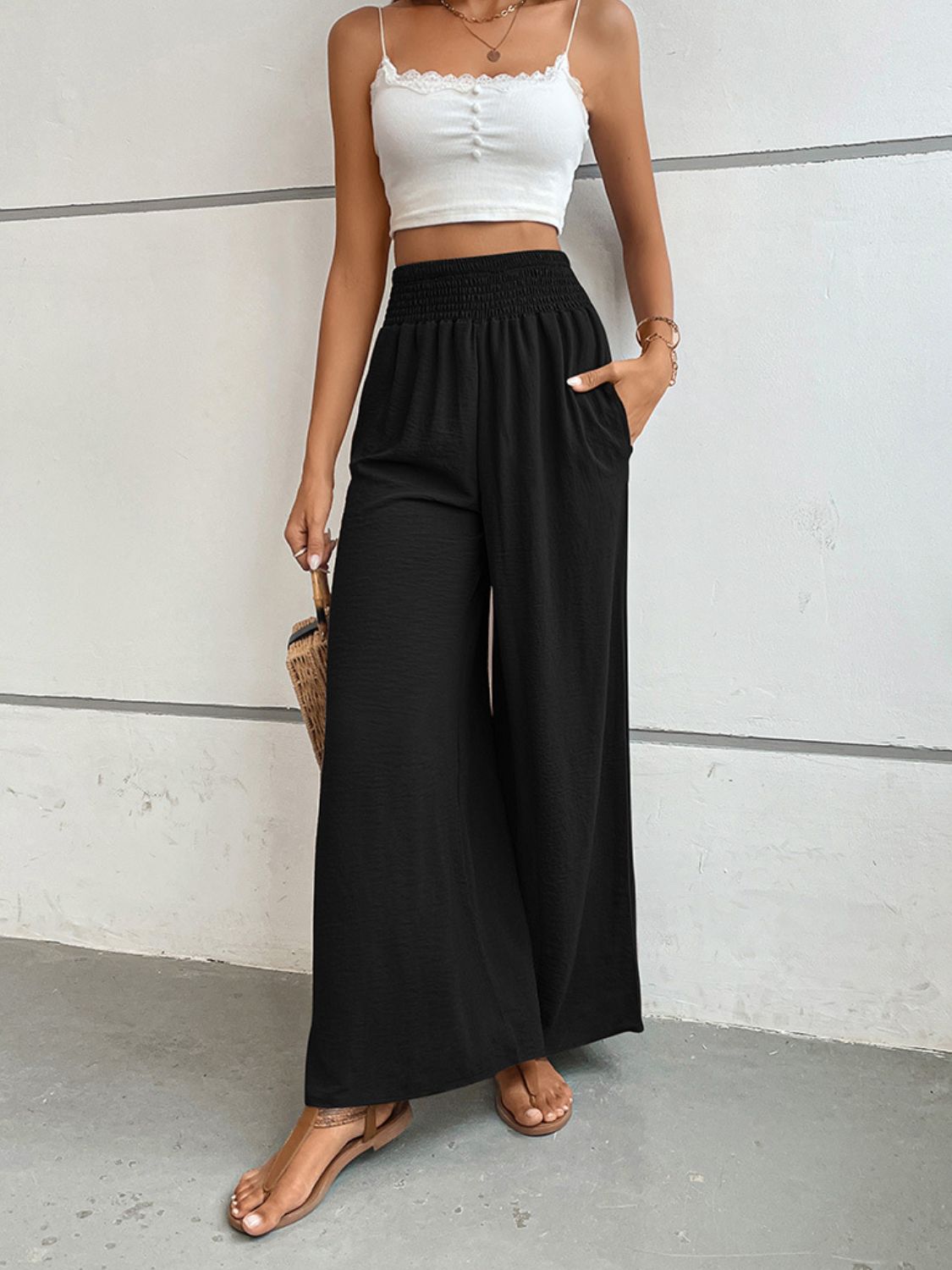 Black wide-leg long pants with elastic waistband and relaxed, flowing legs