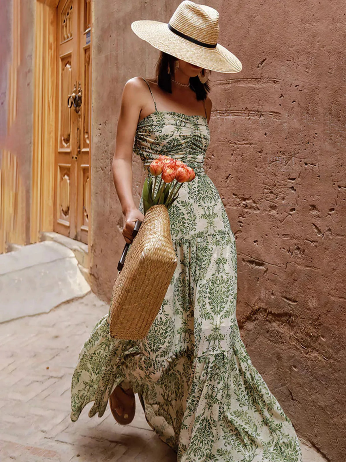 Sage green printed tiered maxi dress with spaghetti straps and open back