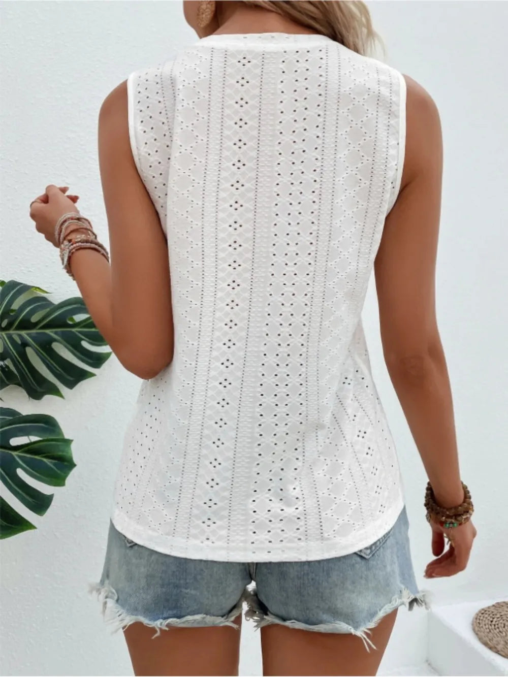 Eyelet round-neck tank in white, sleeveless with vertical eyelet detailing on back