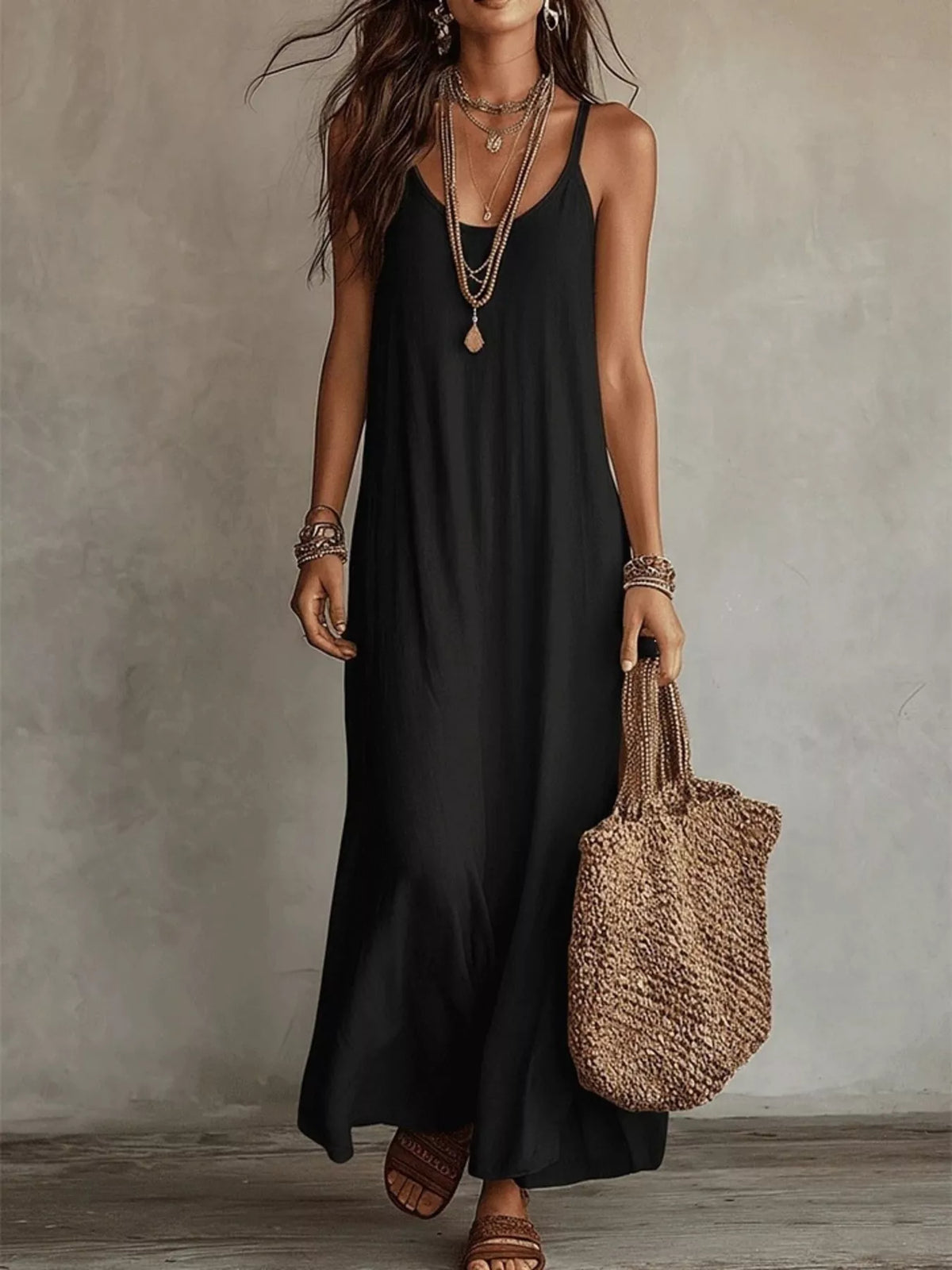 Black scoop-neck maxi dress with spaghetti straps and relaxed flowing silhouette