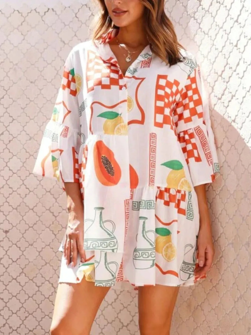 Printed button-front mini dress, white with orange check, fruit and tile patterns, three-quarter sleeves