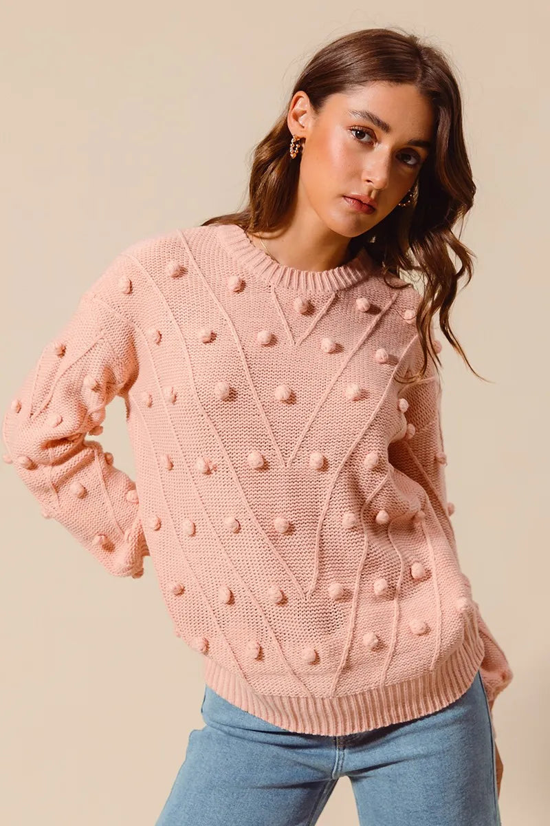 Blush textured knit crewneck sweater with pom-pom dot pattern and ribbed hem