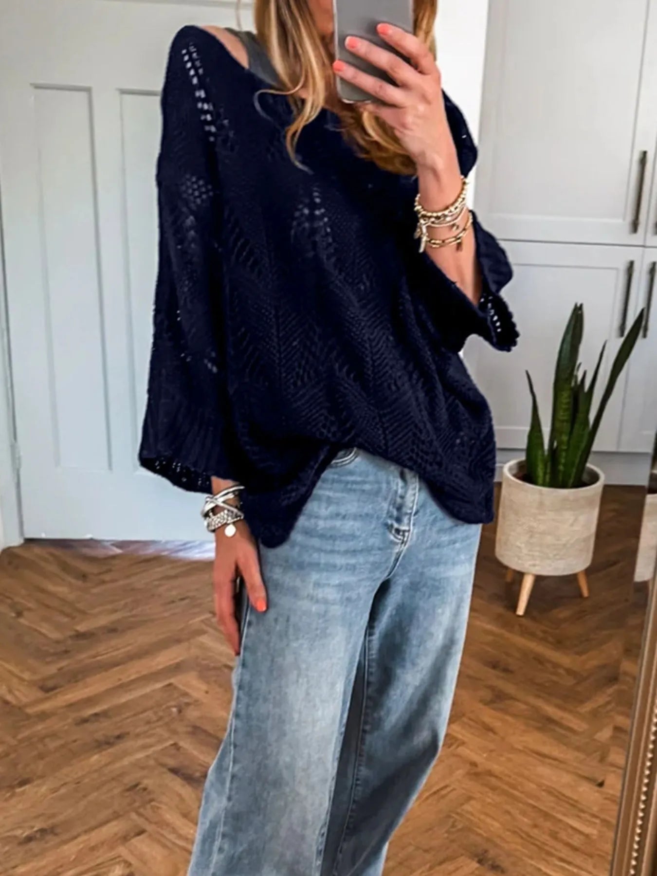 Navy crochet long-sleeve sweater with loose wide sleeves and textured knit pattern