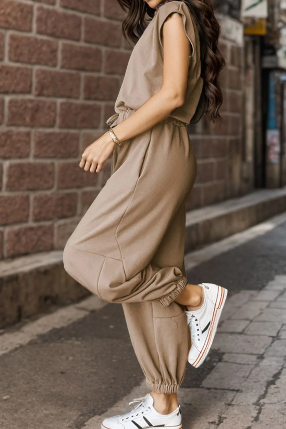 Khaki cap-sleeve jumpsuit with drawstring waist and gathered ankle cuffs