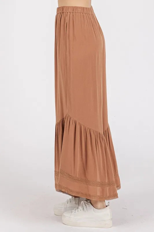 Caramel wide-leg pants with elastic waist and tiered ruffle detail at hem