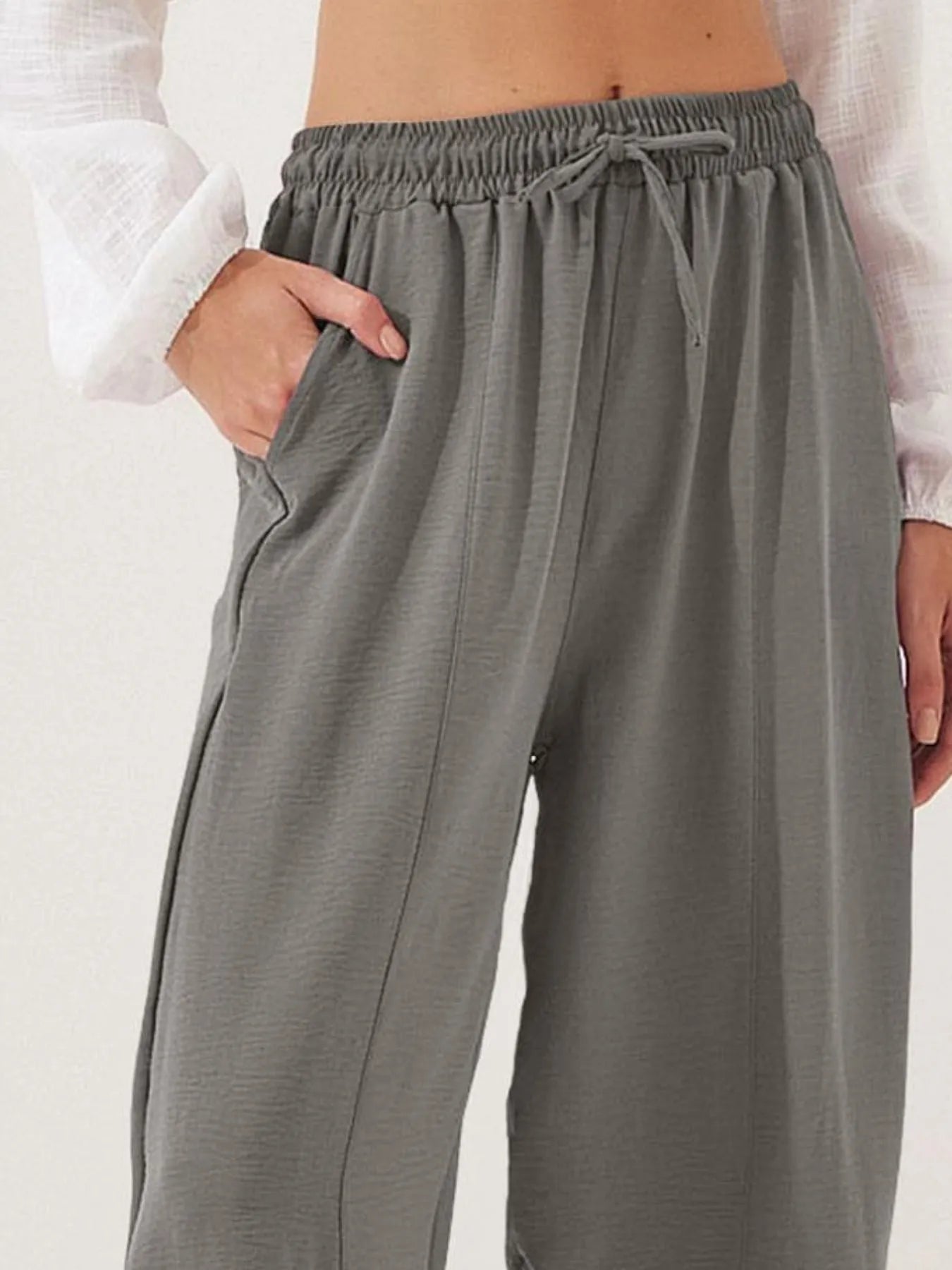 Cropped wide-leg pants in gray with ruched elastic waist and drawstring
