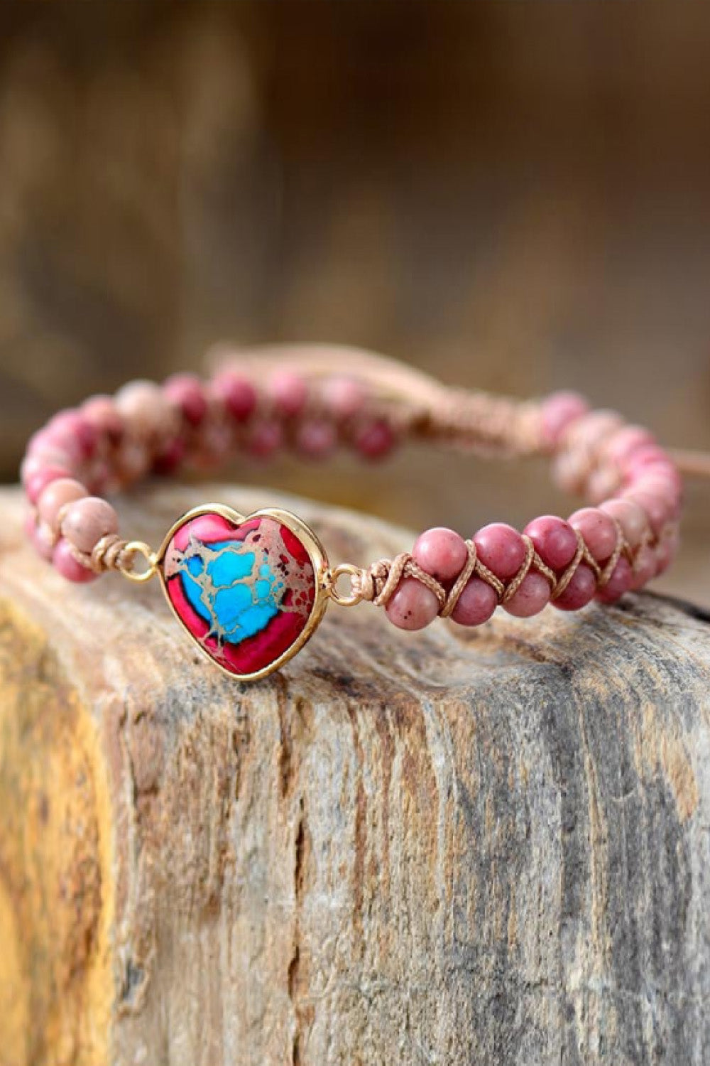 Pink beaded bracelet with heart-shaped turquoise stone charm and silver-tone clasp