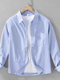 Men's striped button-up long sleeve shirt, light blue with chest pocket
