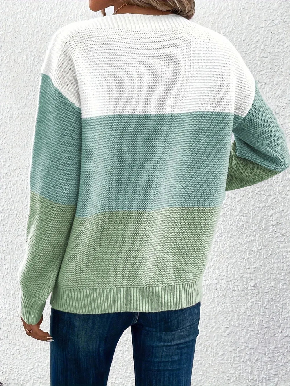 Back view of boat-neck sweater in white with mint green lower and upper band