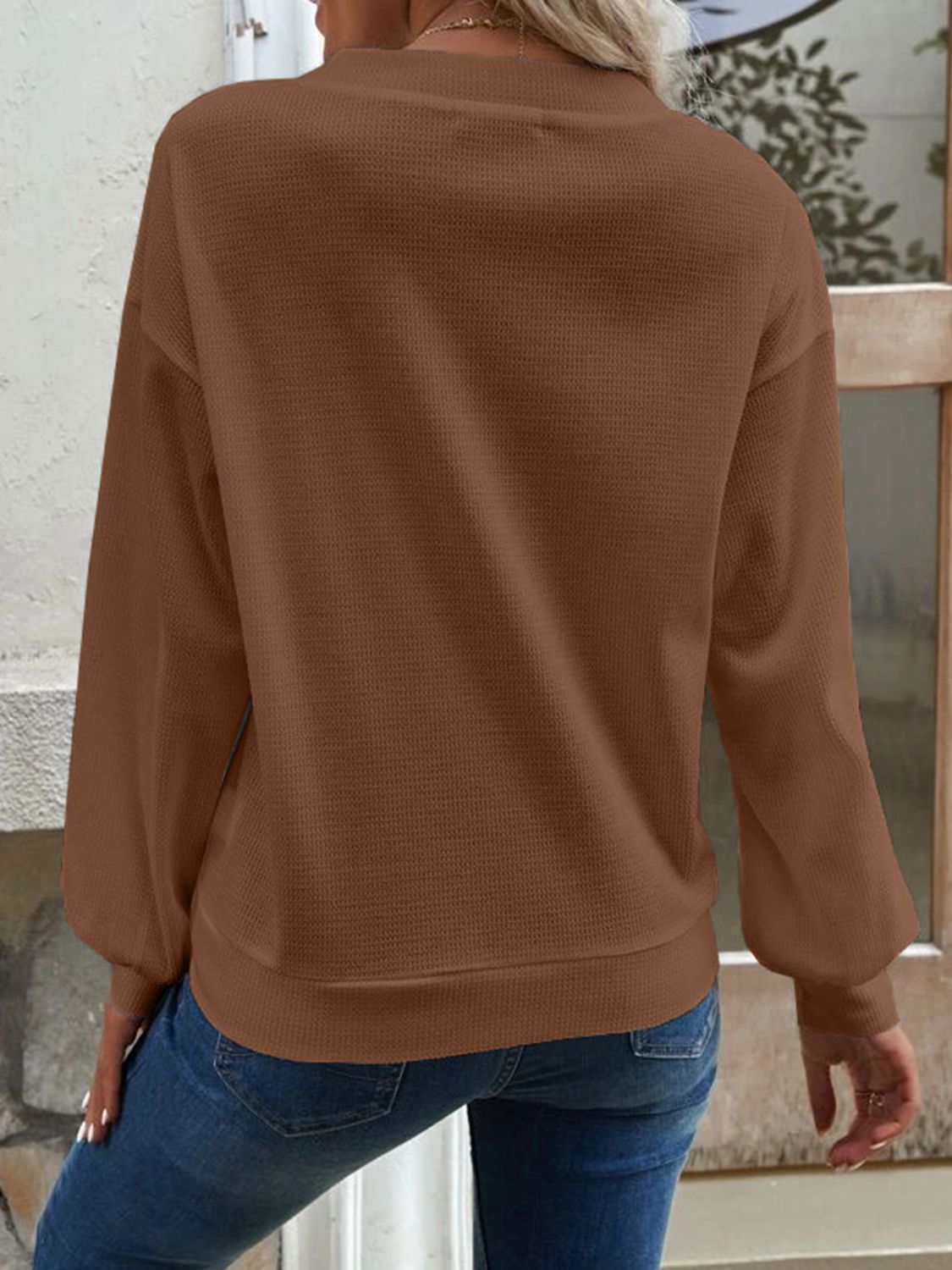 Caramel-brown blouse with V-neck, dropped shoulders, long sleeves, back view