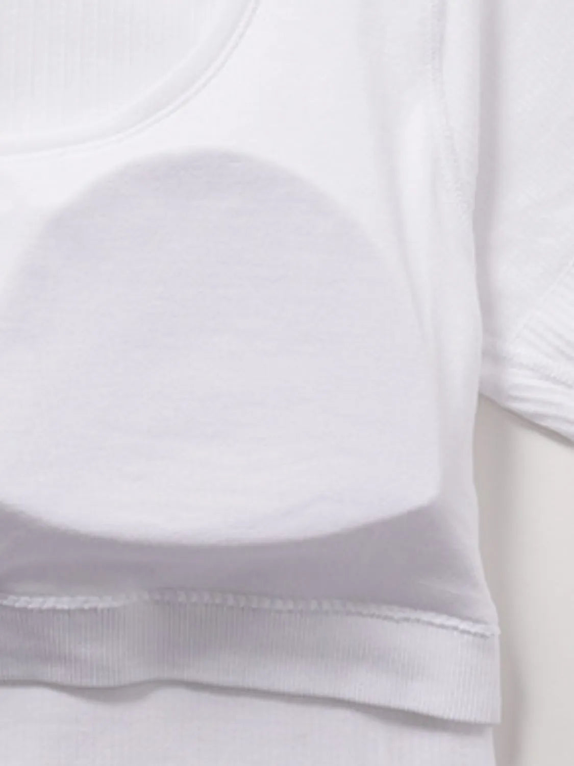 White ribbed active t-shirt fabric and stitched hem edge