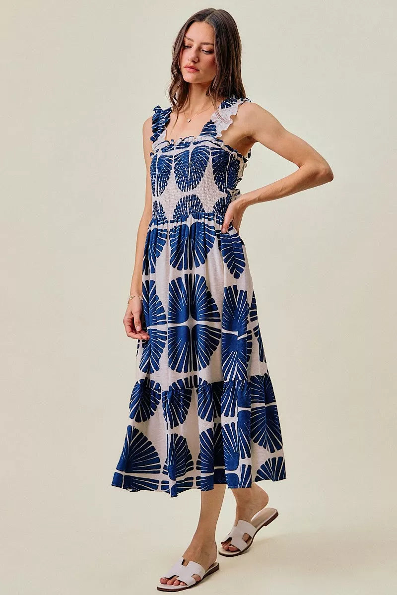 Navy and white abstract print tiered midi dress with ruffled straps and smocked waist