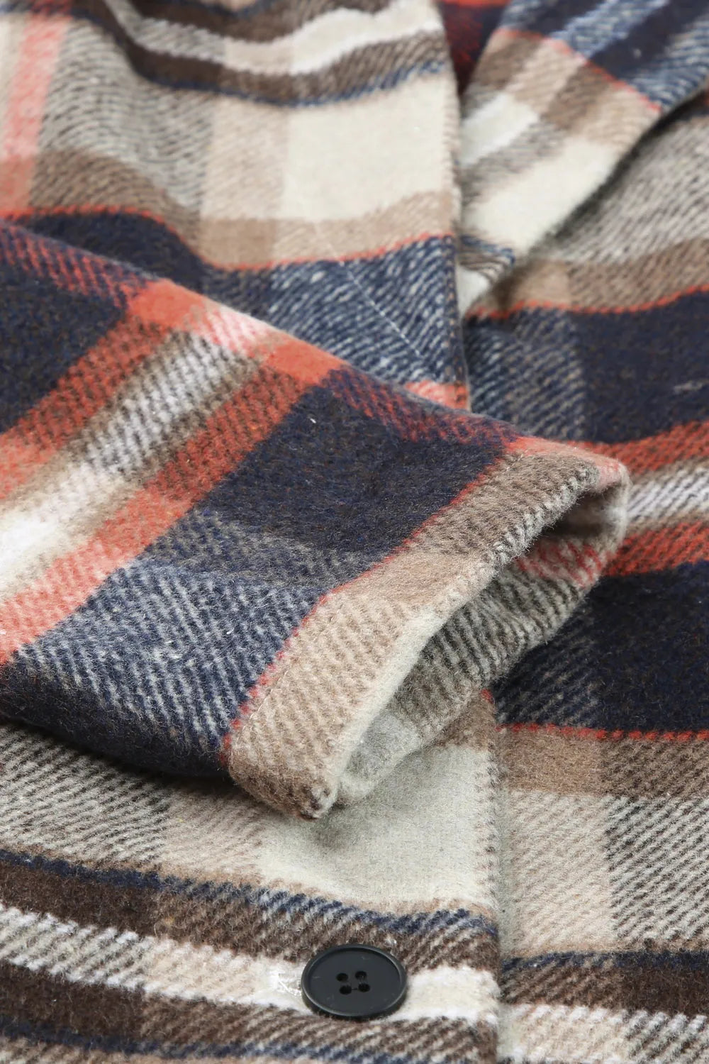 Plaid jacket fabric close-up with button, beige, navy, and orange check pattern