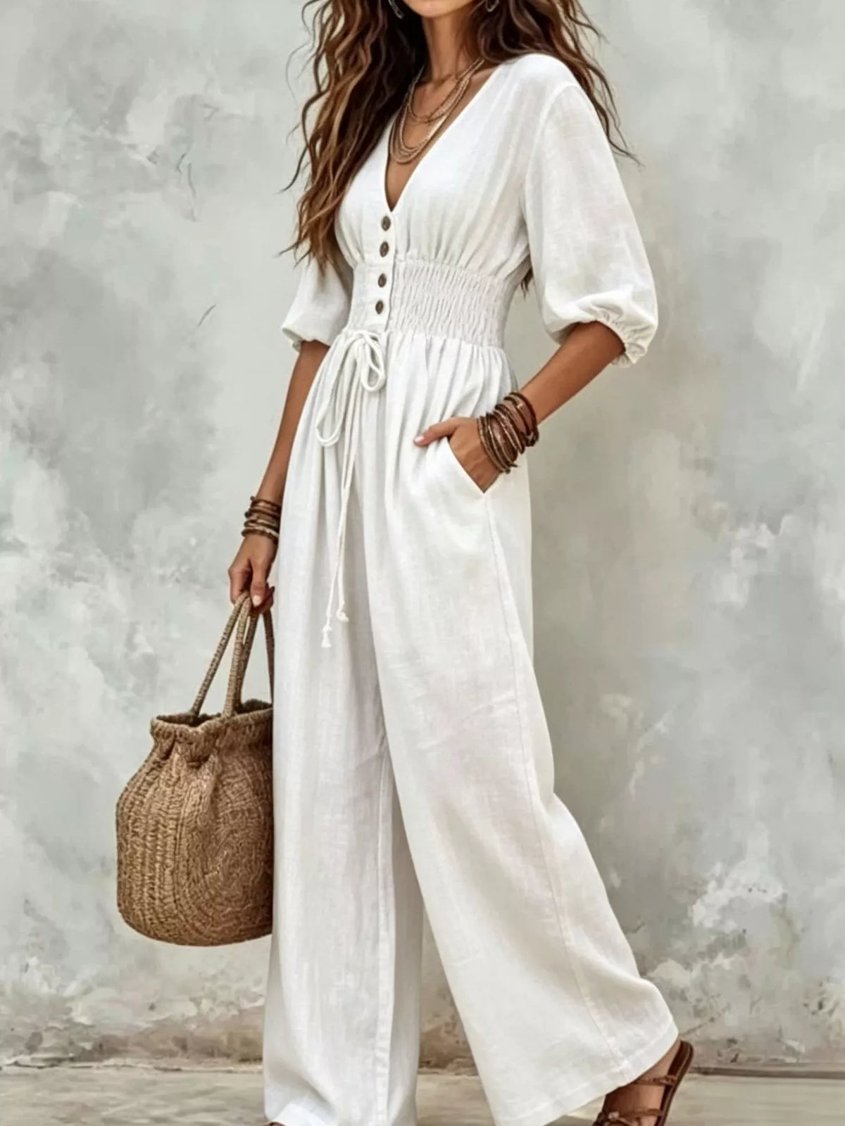 White v-neck smocked-waist wide-leg jumpsuit with button placket and puff sleeves