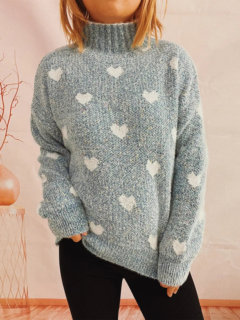 Heart-patterned heathered blue turtleneck drop-shoulder sweater, front view