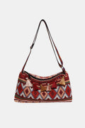 Tassel adjustable shoulder bag in dark red with geometric patterned front and top zipper