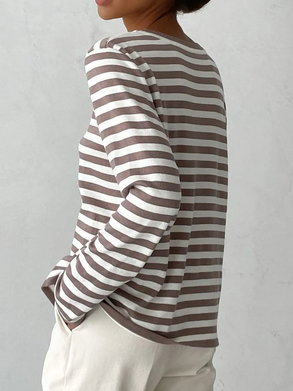 Striped long-sleeve sweater with round neck, mocha and white horizontal stripes.