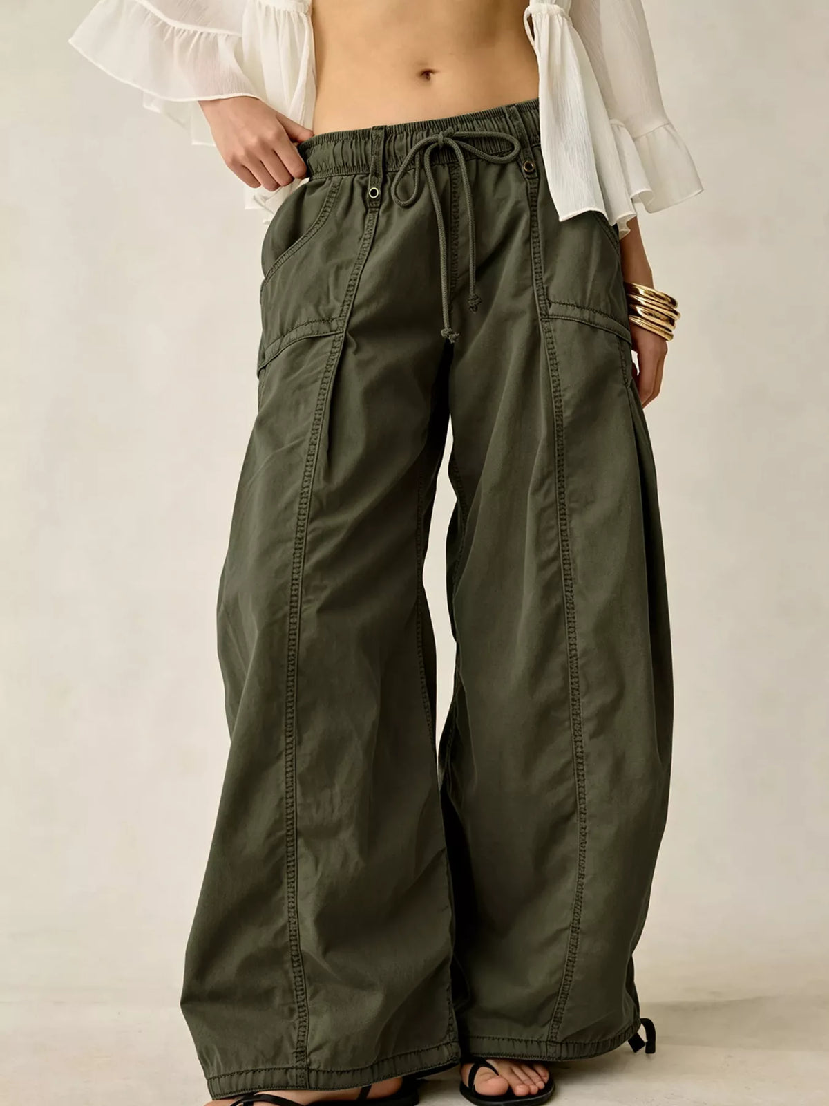 High-waisted cargo wide-leg pants in olive green, drawstring waist and side cargo pockets