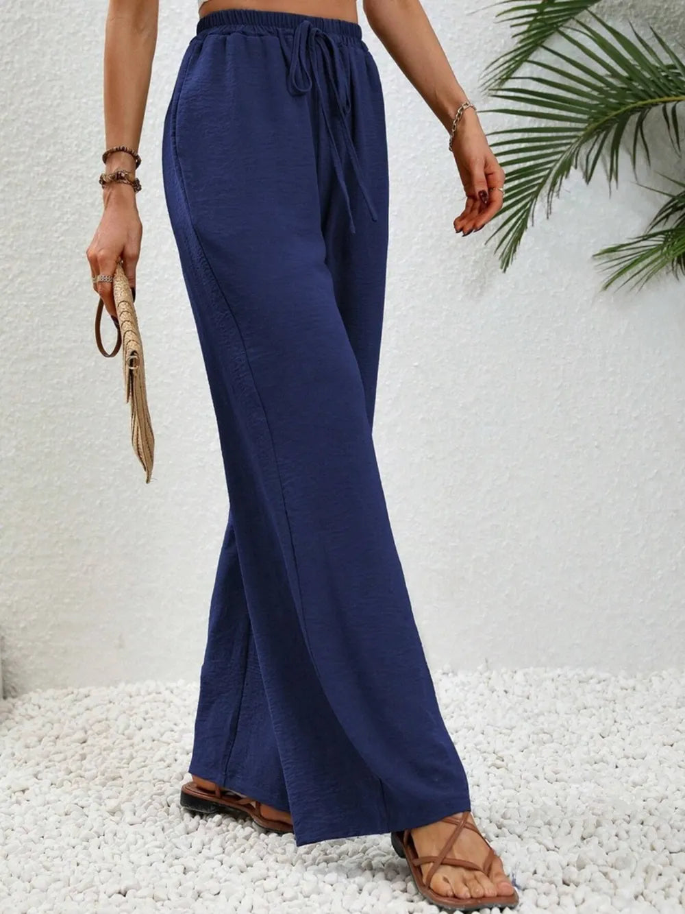 Dark blue wide-leg drawstring pants with adjustable drawstring waist