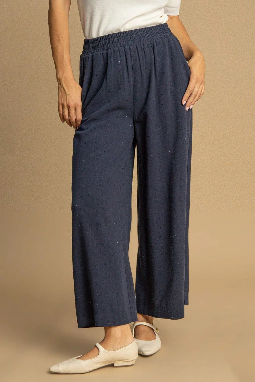 High-waisted dark blue linen pants with elastic waist and wide legs