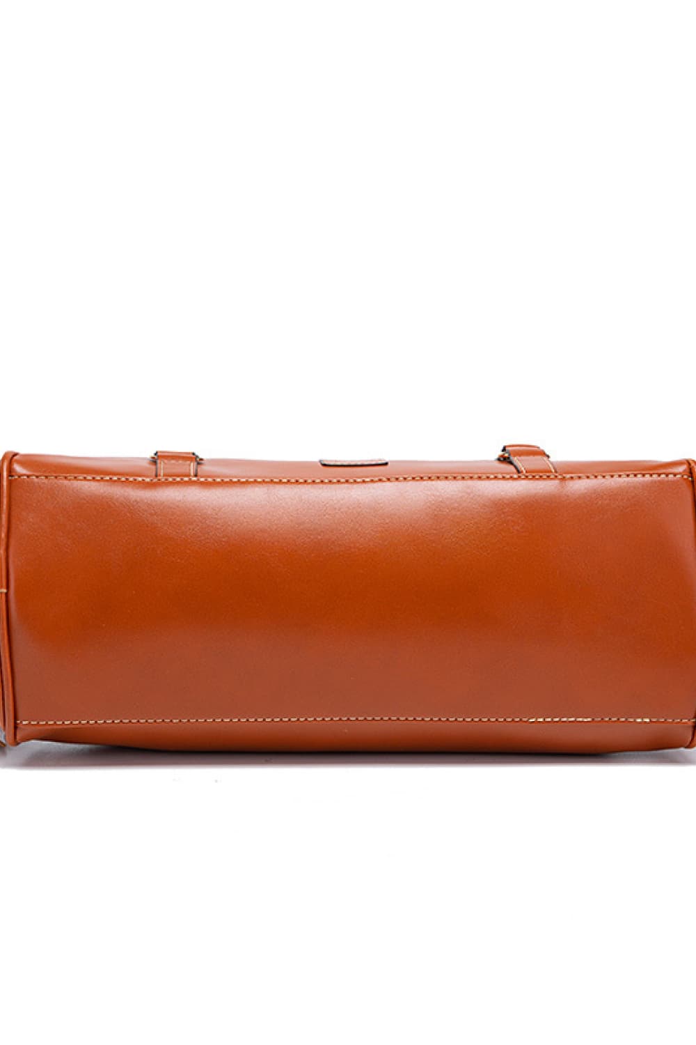 PU leather handbag side view with zip closure and smooth, structured shape.