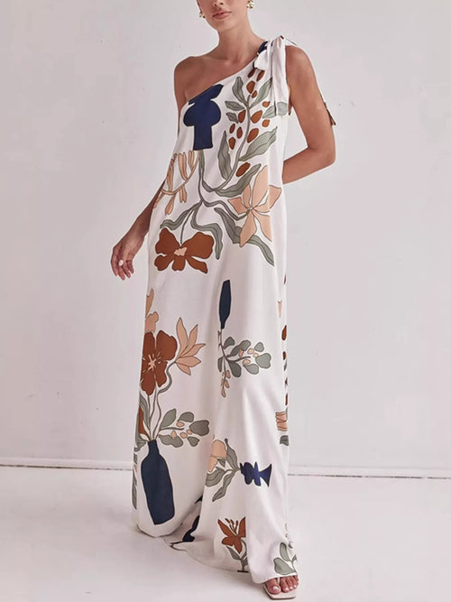One-shoulder maxi dress with floral print on white, side view, knotted shoulder strap
