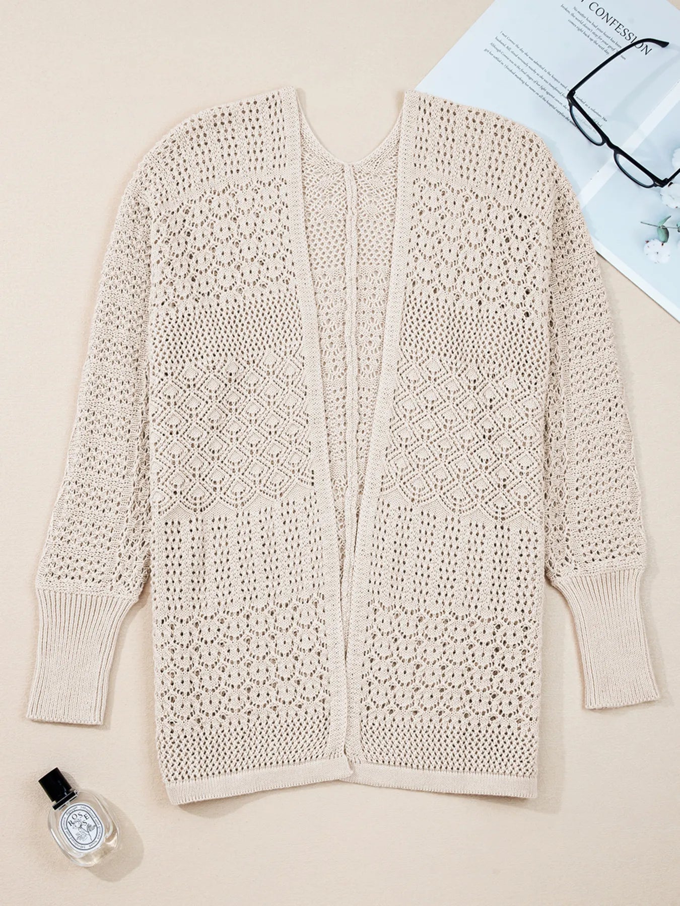 Beige open-front hollow-knit cardigan with textured lace panels and long sleeves