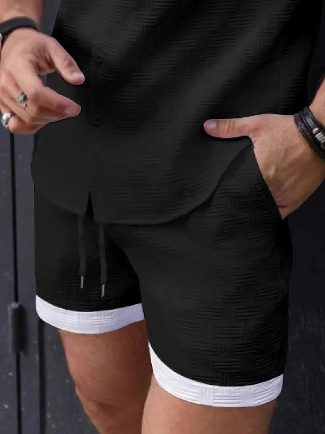 Men's drawstring textured shorts, black with white trim and side slit