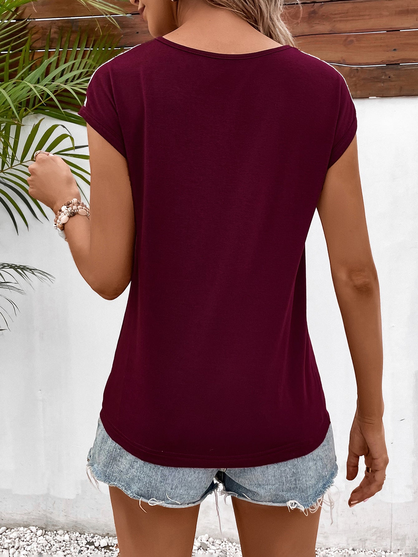 Cedar & Moore Ivy Lane Spliced Lace V-Neck Twisted Hem Tee, burgundy, back view on model