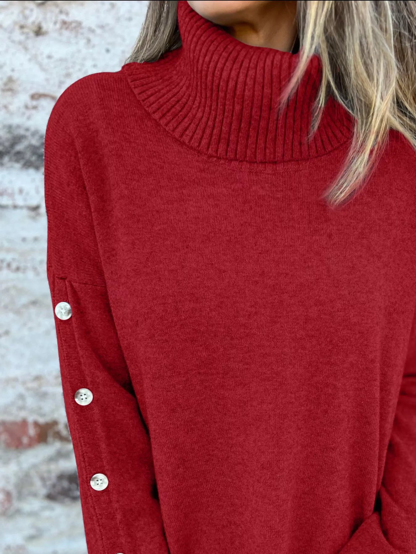 Burgundy turtleneck long-sleeve sweater with ribbed collar and buttoned cuffs