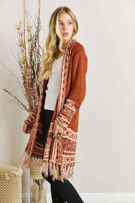 Rust aztec border cardigan with fringe hem and striped aztec trim on sleeves