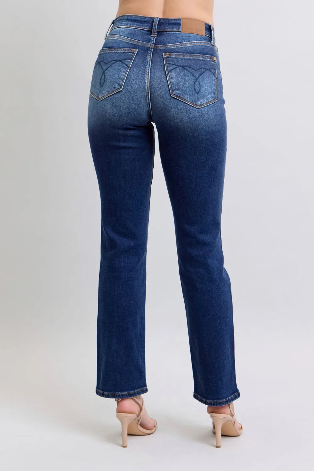 Washed dark blue straight-leg jeans with back pockets and yoke stitching