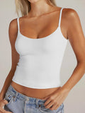 White scoop-neck cami with thin spaghetti straps and ruched waist seam