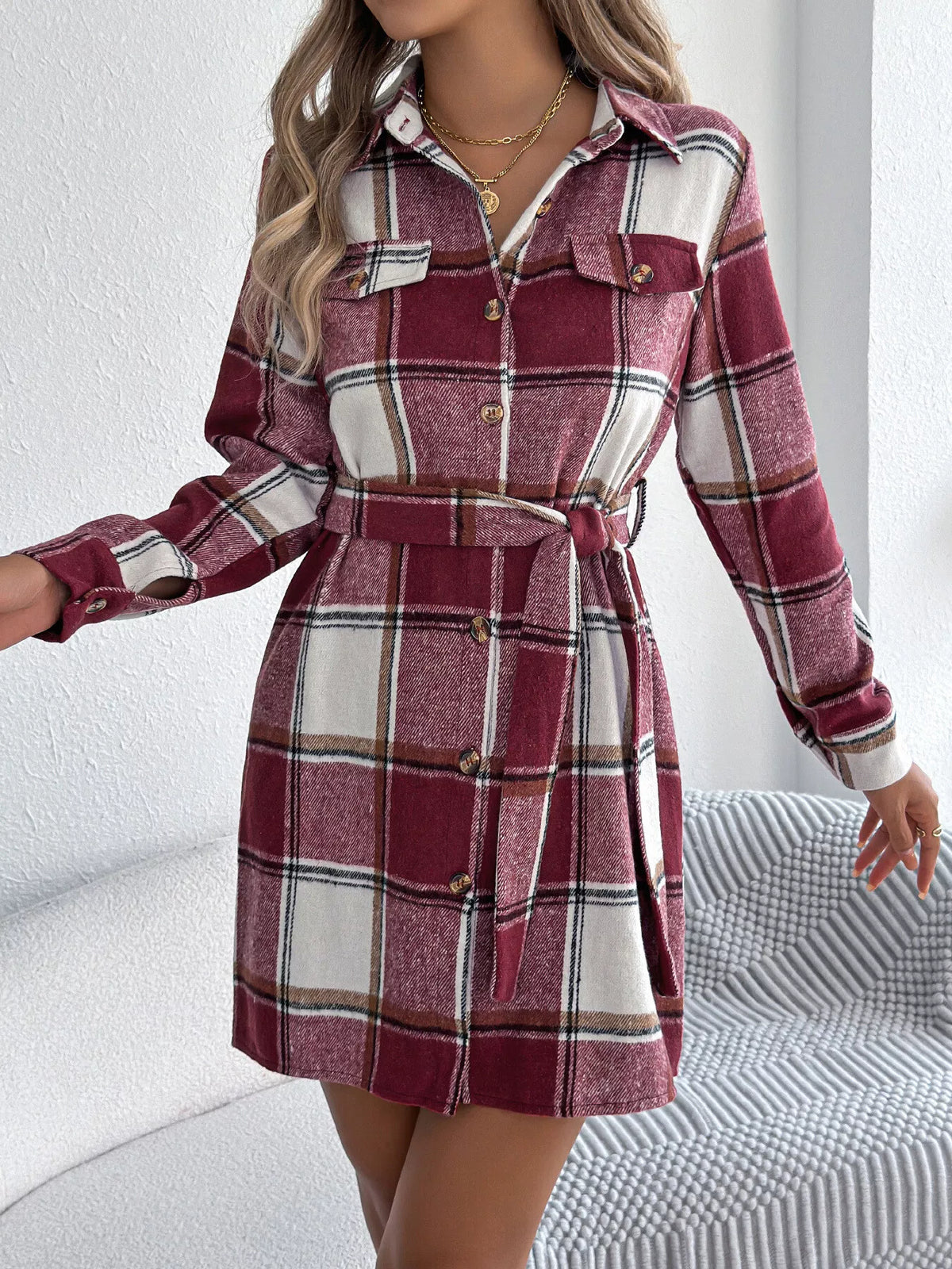 Burgundy plaid belted button shirt dress with collar, long sleeves, and front buttons.