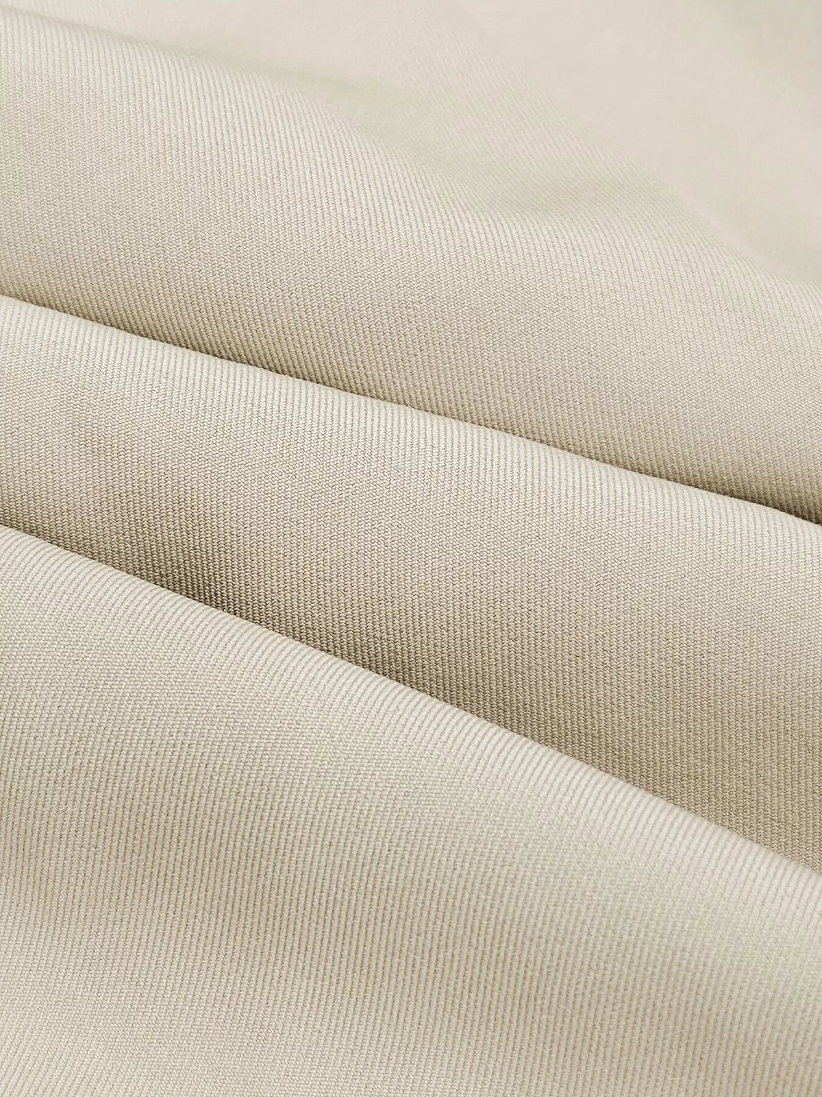 Apricot skirt fabric close-up with fine woven texture